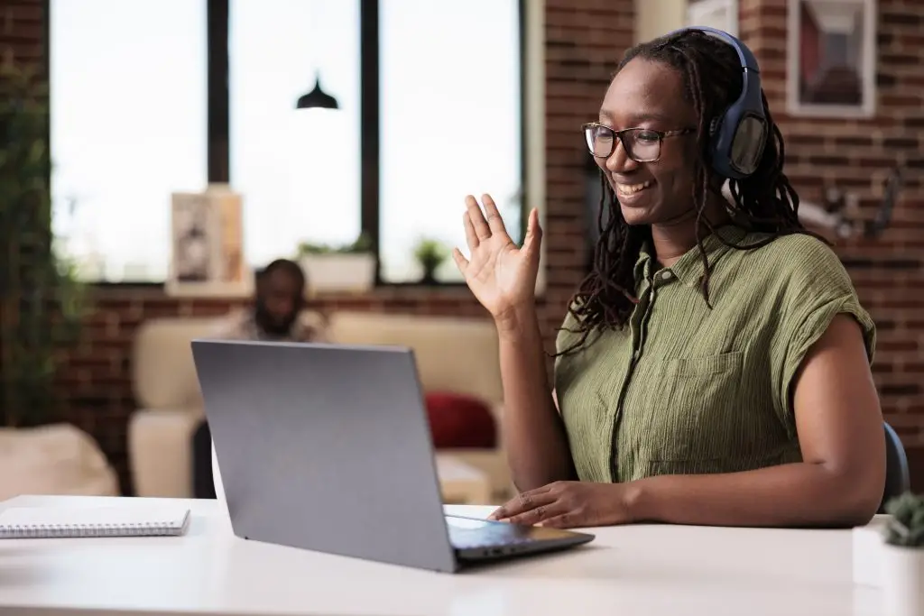 Coach connecting with learners on a video call